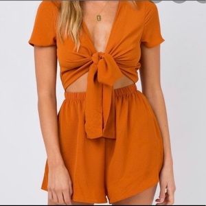Raised by wild orange romper
